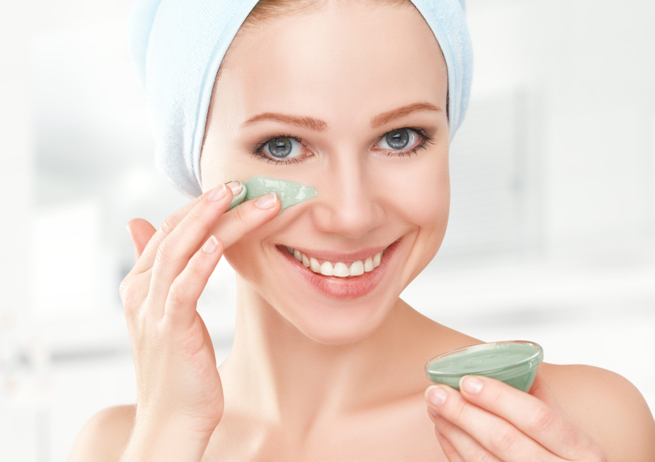 Beautiful Girl In Bathroom And Mask For Facial Skin Care